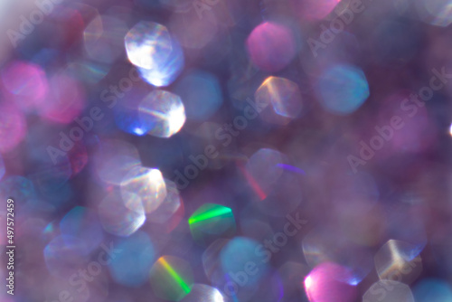 Abstract defocused multicolored background with shining glitter.Good as overlay layer.