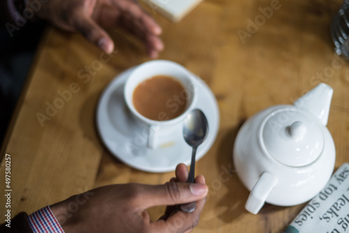 person with cup of tea