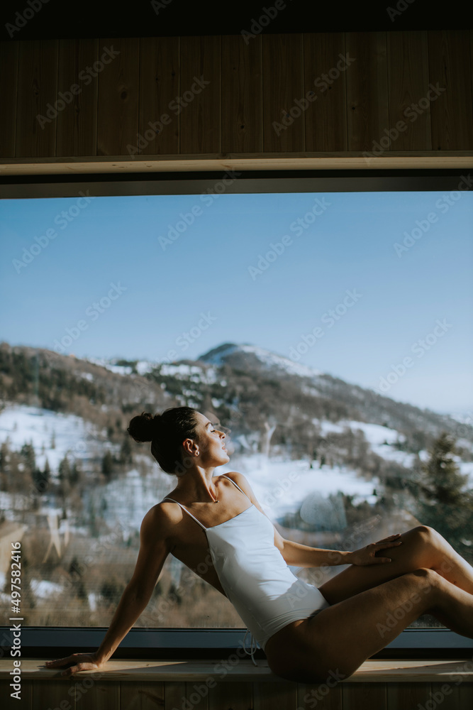 Young woman relaxing in the spa at winter season