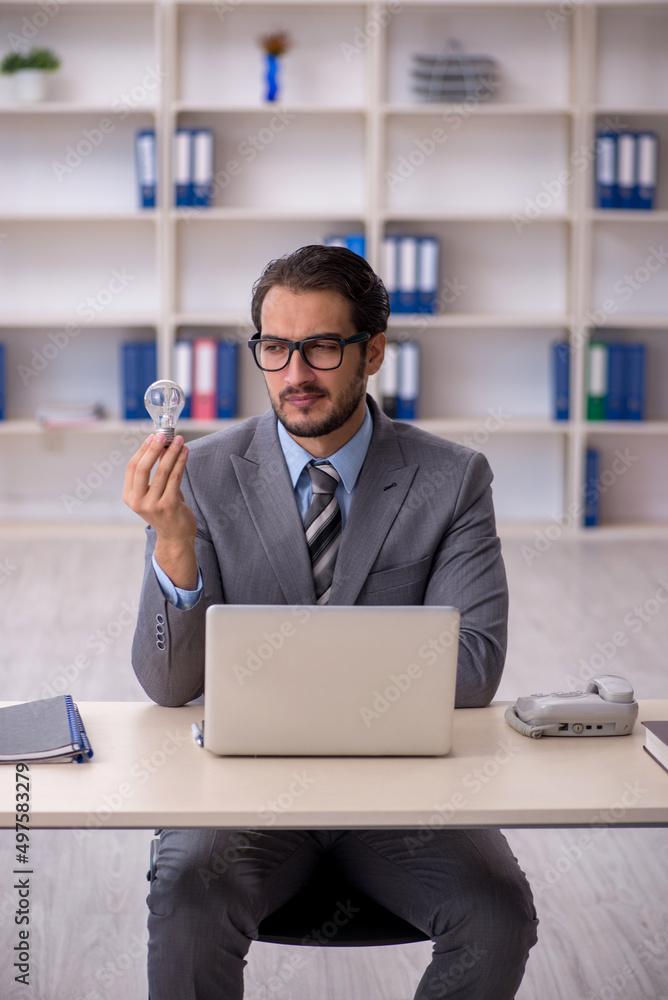 Young male employee in happy idea concept Young male employee in happy idea concept