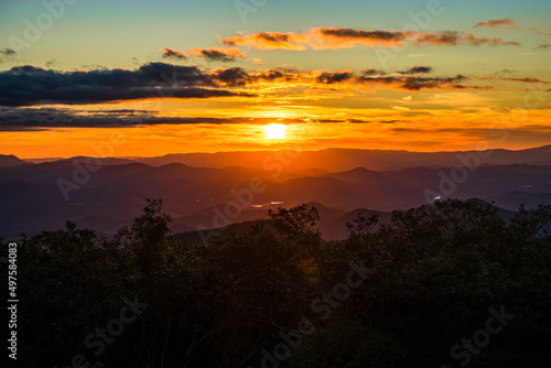 Scattered clouds decorate a sunset over the Appalachian Mountains in Georgia
