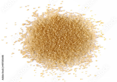 Brown crystal cane sugar pile isolated on white, top view
