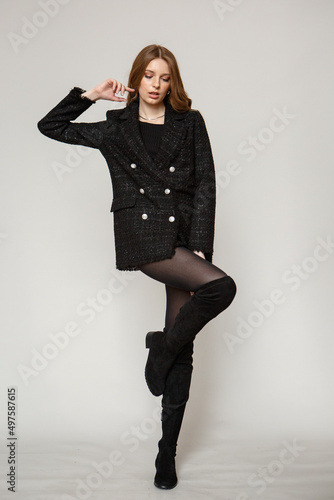 A model in black strict clothes. Fashion show