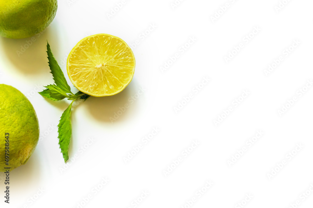 lime lemon with mint sprig isolated on white background copy space