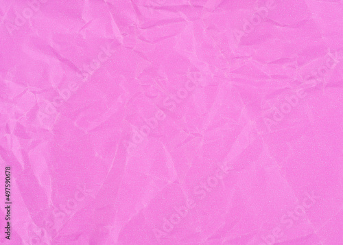 Wrinkled sheet of pink paper. Textured backdrop