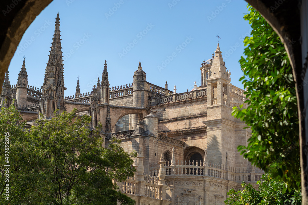 Obraz premium Old historical Andalusian town Seville, Spain. View on architectural details of Gothic cathedral church.