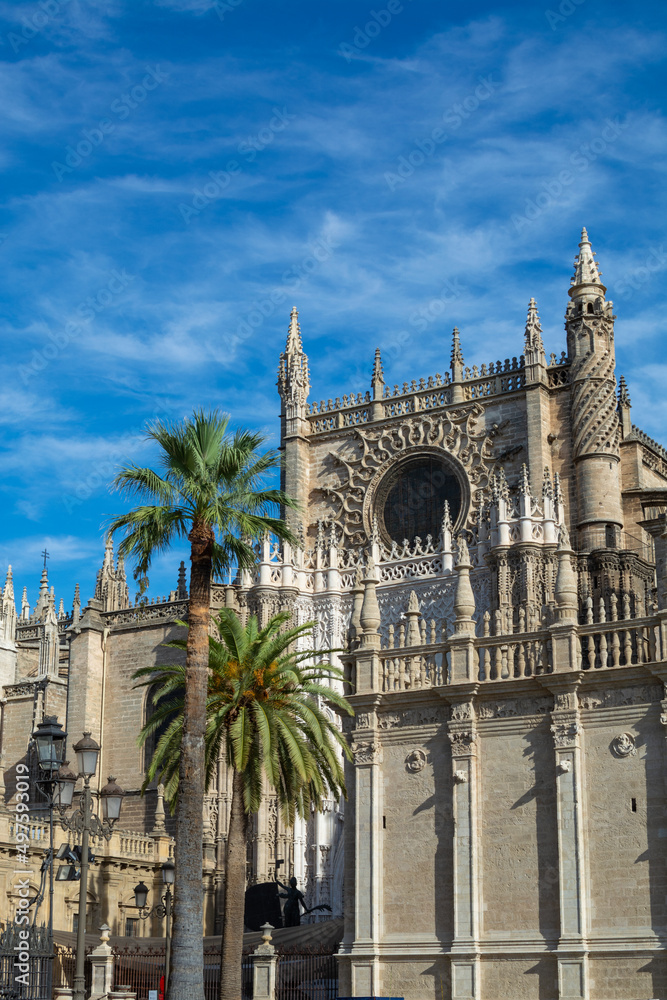 Old historical Andalusian town Seville, Spain. View on architectural details of Gothic cathedral church.