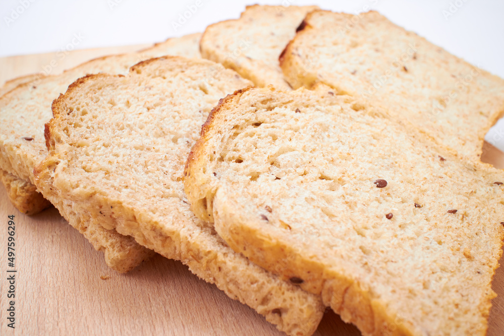 wholegrain toasts on the wooden board wholegrain toasts on the wooden board