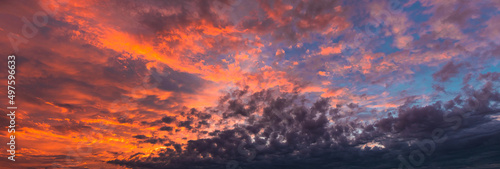 Beautiful sunset sky. Pink and orange fluffy clouds. Atmospheric natural background. © Galina Atroshchenko