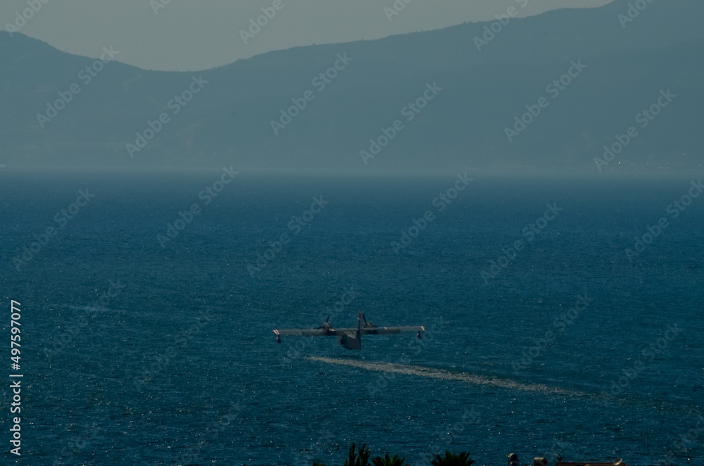 fire plane flying on sky