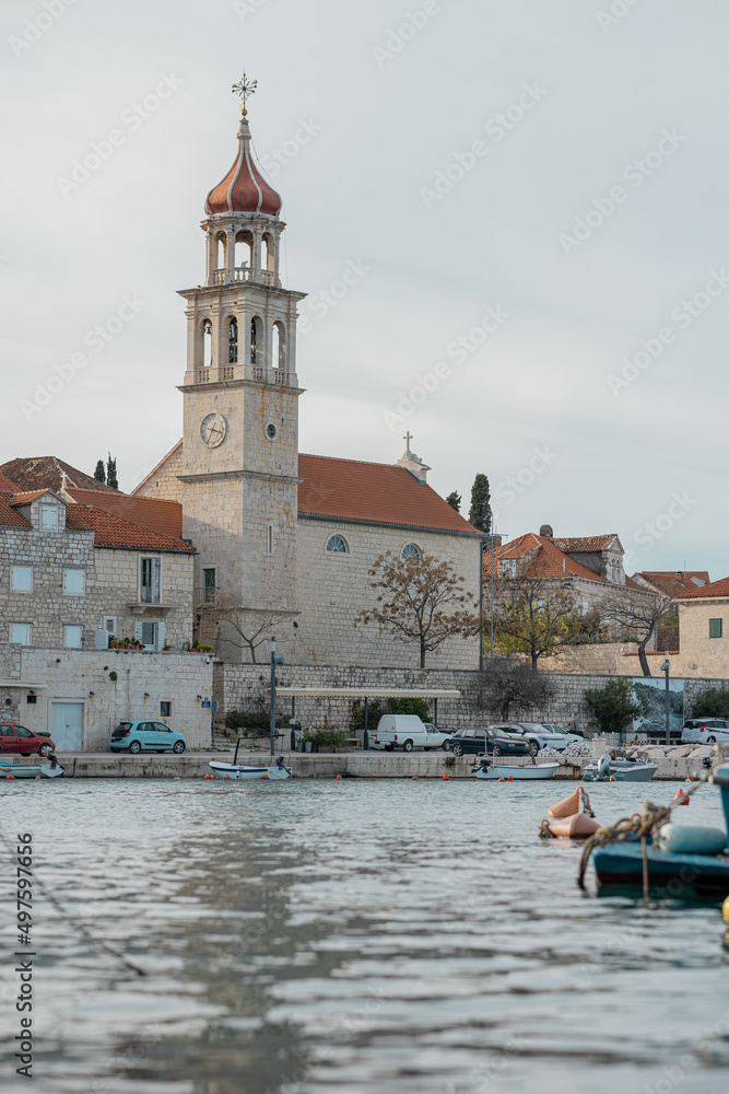 Beautiful historic church with a picturesque belltower in Sumartin, on the island Brac in Croatia in winter time.