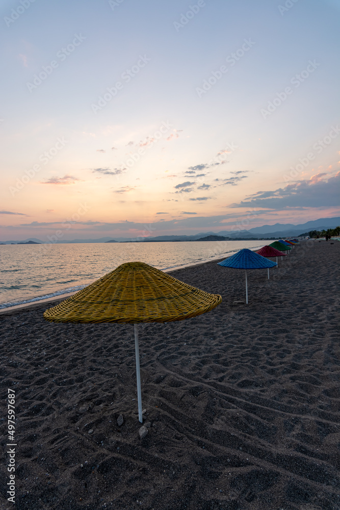 sunset beach sun beds parasol