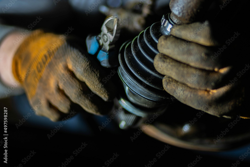 installation of the drive shaft of the joint and half shaft in the engine gearbox, a metal clamp