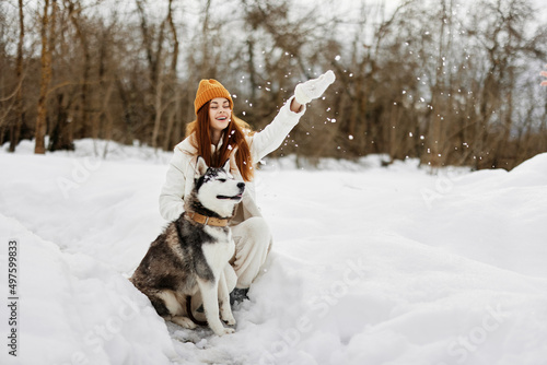 Fototapeta Naklejka Na Ścianę i Meble -  cheerful woman winter landscape walk friendship winter holidays