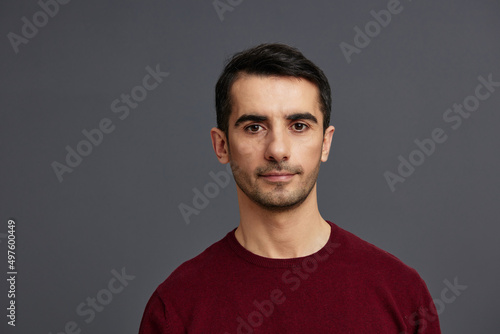 man in a red sweater hand gesture posing self confidence isolated background