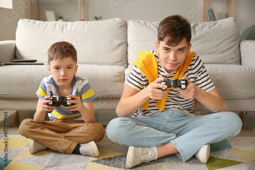 Cute brothers playing video...