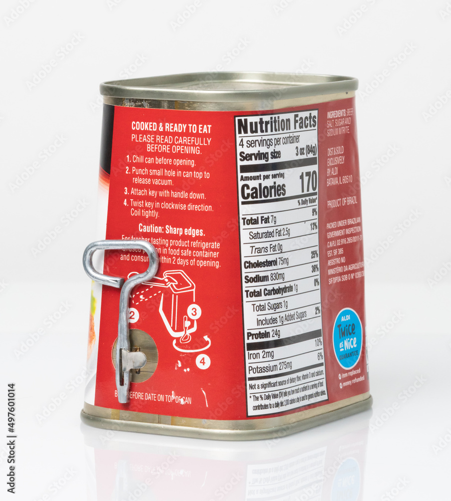Angled view of side and back of single use metal can with key opener