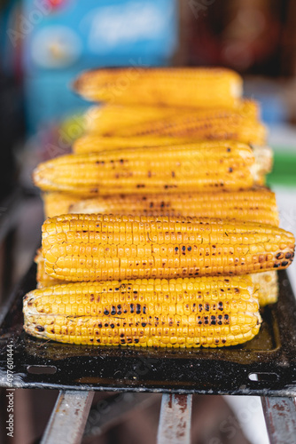 Vertical of many delicious grilled corn ready to eat  photo