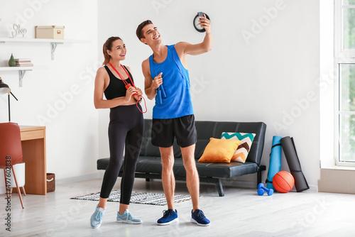 Sporty young couple taking ...