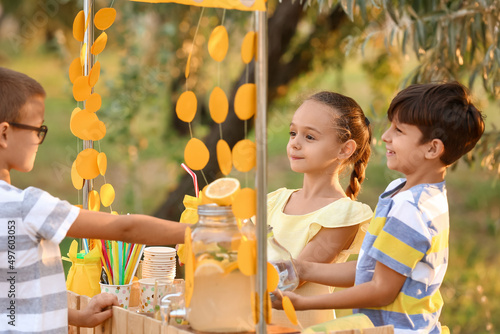 Cute children selling lemon...