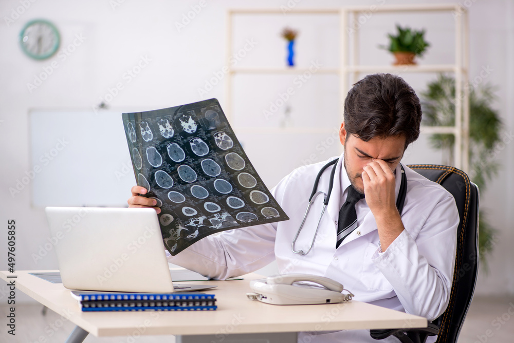 Young male doctor radiologist working in the clinic Young male doctor radiologist working in the clinic