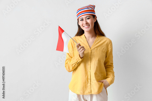 Young Asian woman with flag...