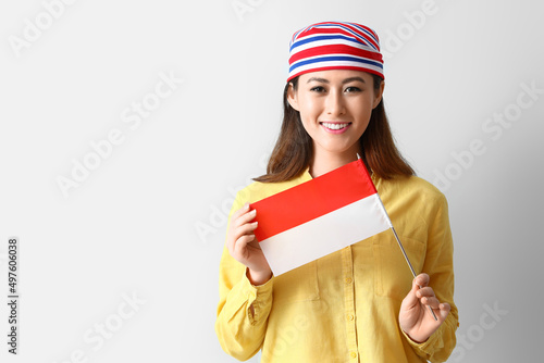 Young Asian woman with flag...