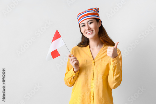 Young Asian woman with flag...