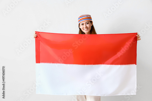 Young Asian woman with flag...