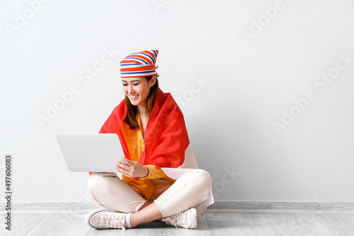 Young Asian woman with flag...