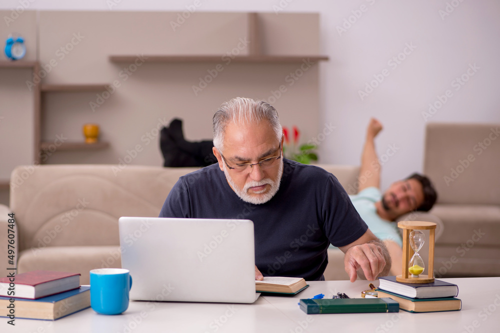 Old grandfather in distant learning concept during pandemic Old grandfather in distant learning concept during pandemic