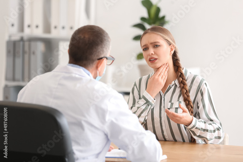 Ill woman with sore throat ...