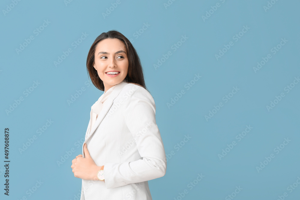 Portrait of young secretary on blue background Portrait of young secretary on blue background