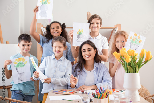 Cute children and teacher w...