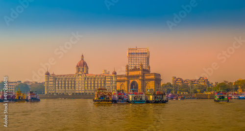 Beautiful Gateway of India near Taj Palace hotel on the Mumbai harbour with many jetties on Arabian sea photo