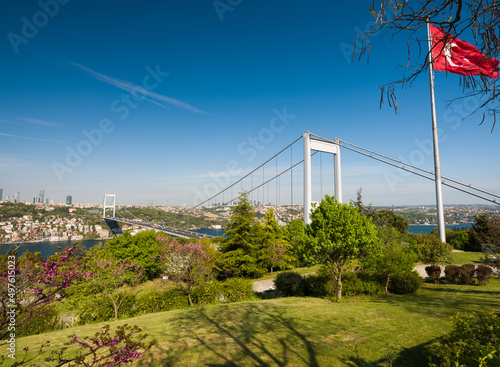 Istanbul landscape in spring. Bosphorus view famous for it's redbud flowers. View of Fatih Sultan Mehmet Bridge from Otagtepe. One of the popular view of Istanbul. Turkey  © daphnusia