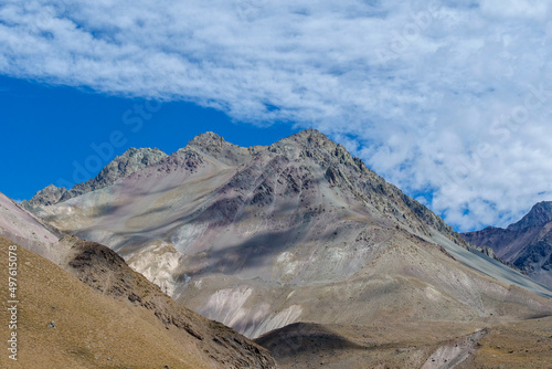 Grey mountain peaks at Valle de Colina  Caj  n del Maipo at San Miguel in Chile   a popular tourist destination.