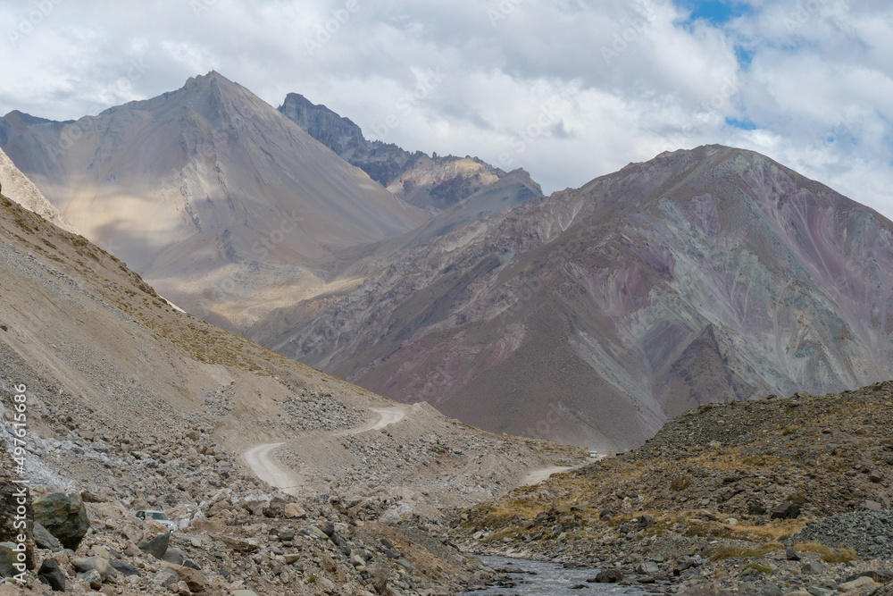 A gravel road leading through the Andes Mountain range en route to Valle de Colina, Chile, South America