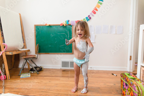 toddler makes a paint mess photo