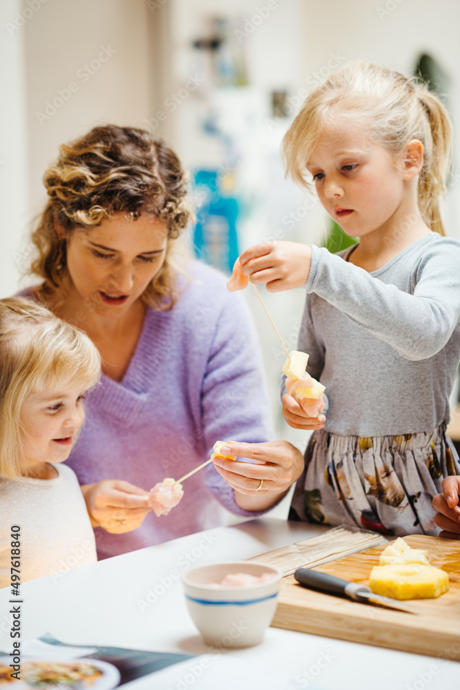 Mom and her little girls cooking Mom and her little girls cooking