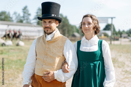 Portraits of a man and a woman in vintage clothes photo
