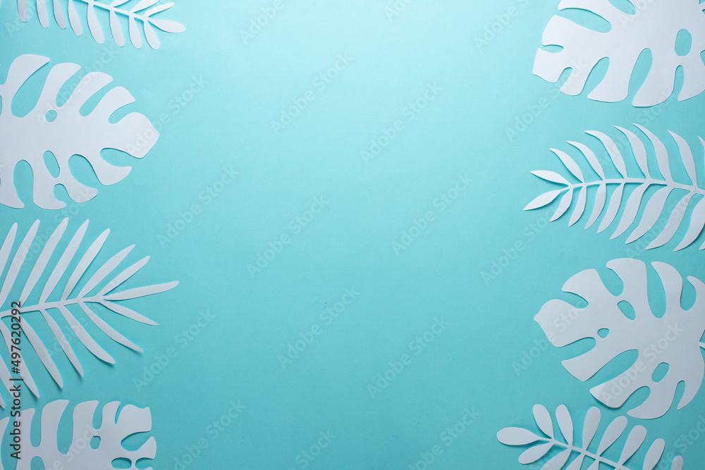 Tropical leaf pattern. Various paper leaves on a pastel background. art. Flat lay, top view. Background on light blue background. Lent background, summer mood