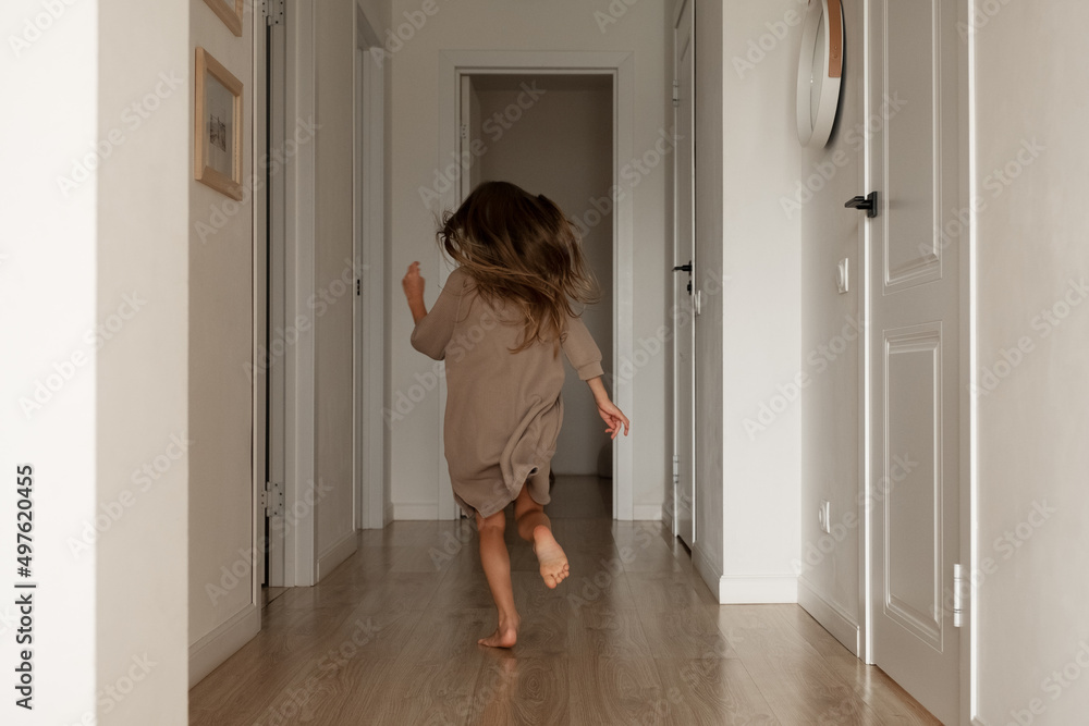Unrecognizable girl running in corridor Unrecognizable girl running in corridor
