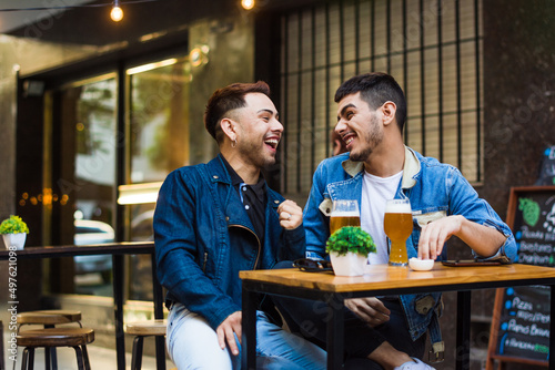 Happy young couple laughing at a date  photo