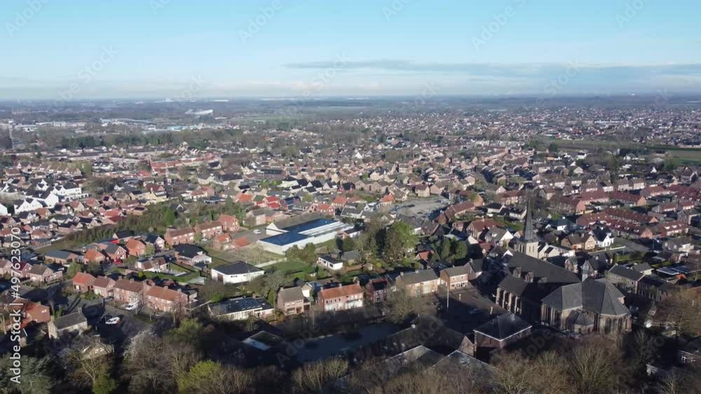 Aerial view village Sprundel in Netherlands with clear blue skies and churches and Rucphen at the horizon Aerial view village Sprundel in Netherlands with clear blue skies and churches and Rucphen at the horizon