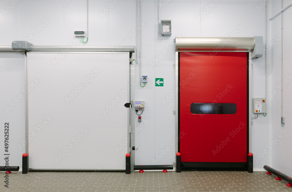 Interior of modern factory with red doors Interior of modern factory with red doors