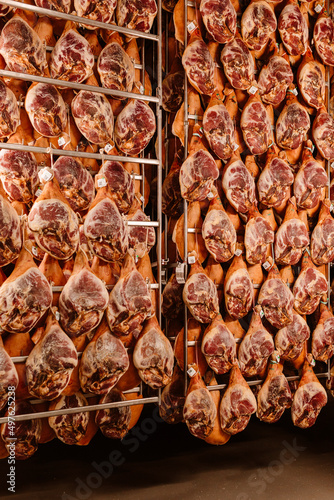 Hung iberian hams in factory