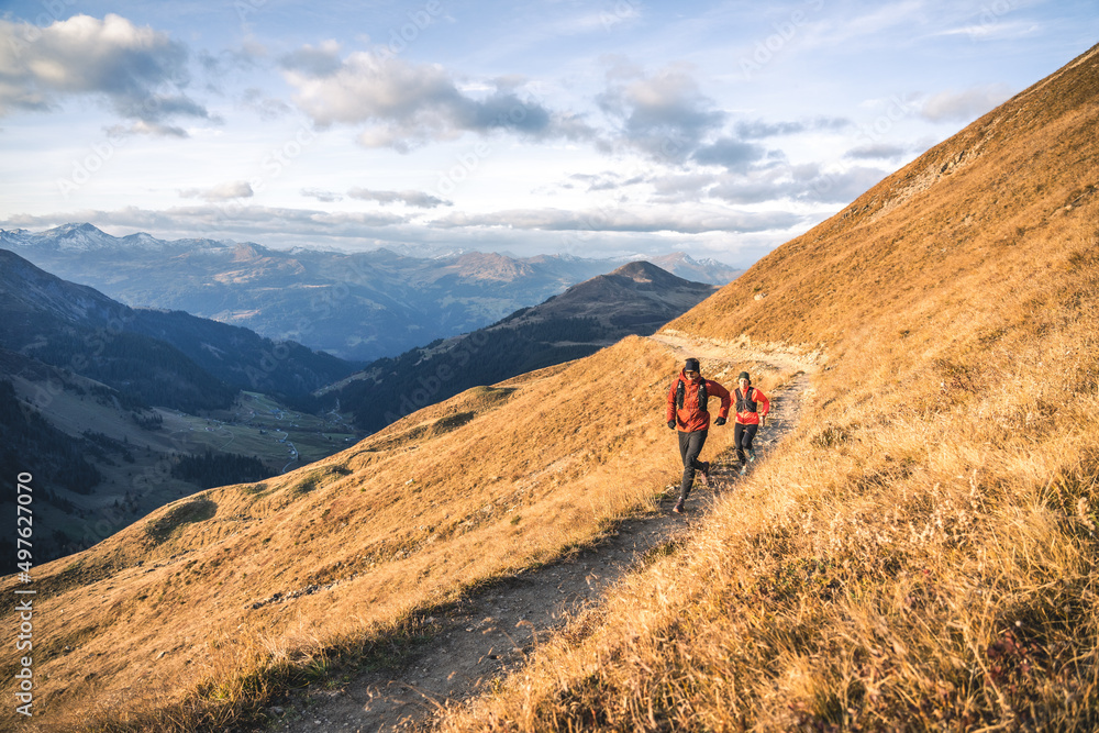 Trail runners in a beautiful mountain landscape. Trail runners in a beautiful mountain landscape.
