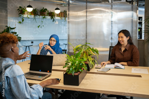 Wallpaper Mural Businesswoman Sitting Around The Desktop In The Office. Torontodigital.ca