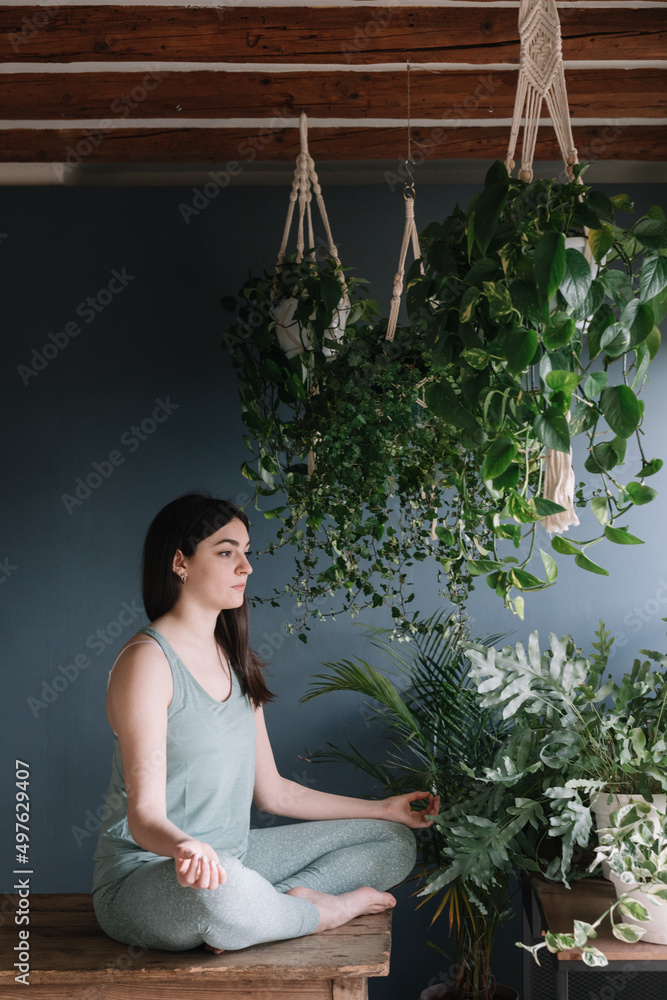 Yoga Teacher Practicing In Zen Studio On Wooden Table Yoga Teacher Practicing In Zen Studio On Wooden Table